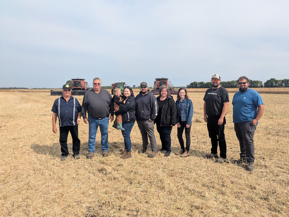 The Bruneau family stands together on their farm north of St. Claude during a break for the Farmer’s Appreciation Lunch. PortageOnline/Ryan Simpson