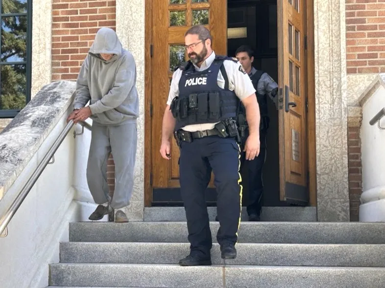 Ricky Manz (left) leaving court last Friday. (Photo by Shawn Mullin)