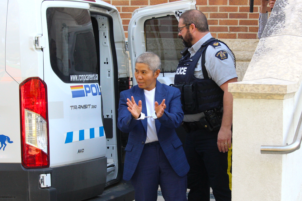 Romana Didulo in cuffs