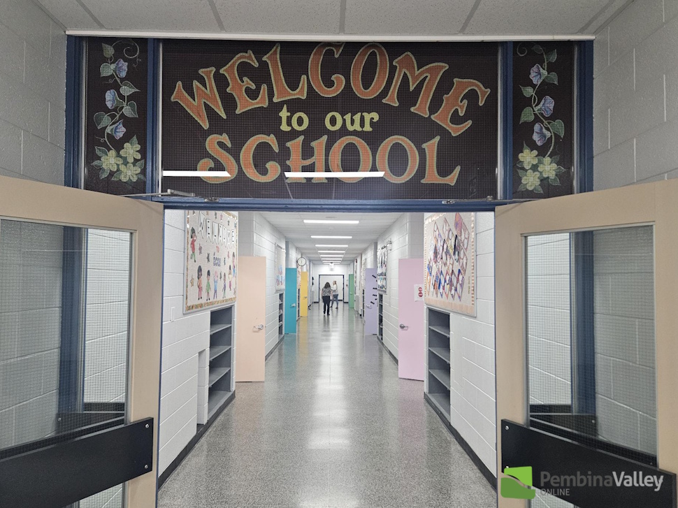 a school hallway with a banner that reads "Welcome to our school"