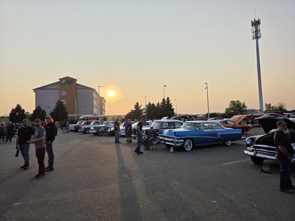 People and cars underneath the setting sun at Tail Light Tuesday. (photos by Hayden Michaels)