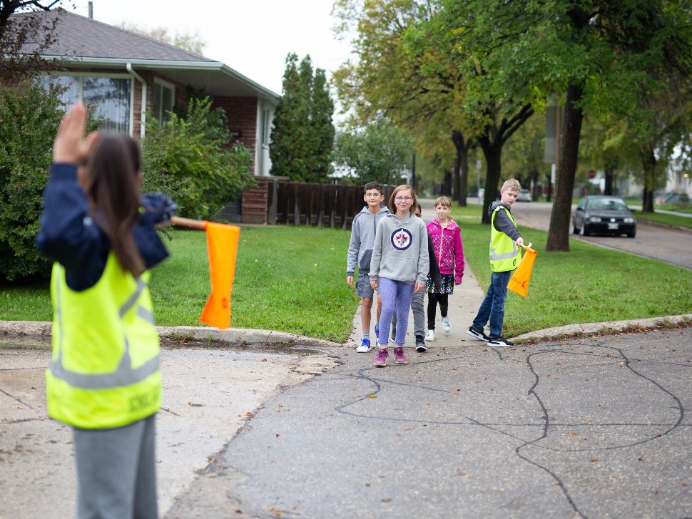 Student crossing guards with kids on their way to school. (Provided by CAA)