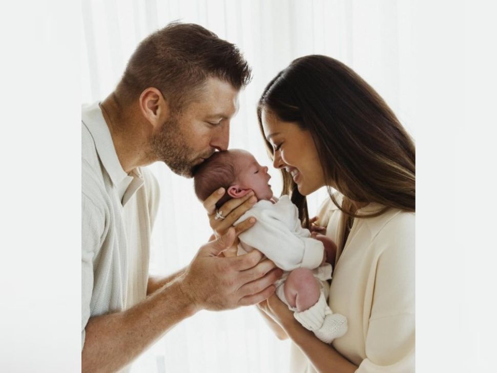 Tim and Demi-Leigh Tebow holding their one month old baby girl, Daphne Reine. 