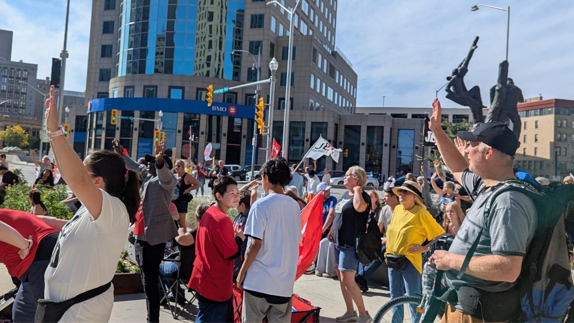People at the Portage and Main intersection worshipping.