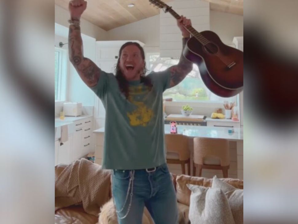 Brandon Lake celebrating in his living room after he found out he was nominated for a CMA award. 