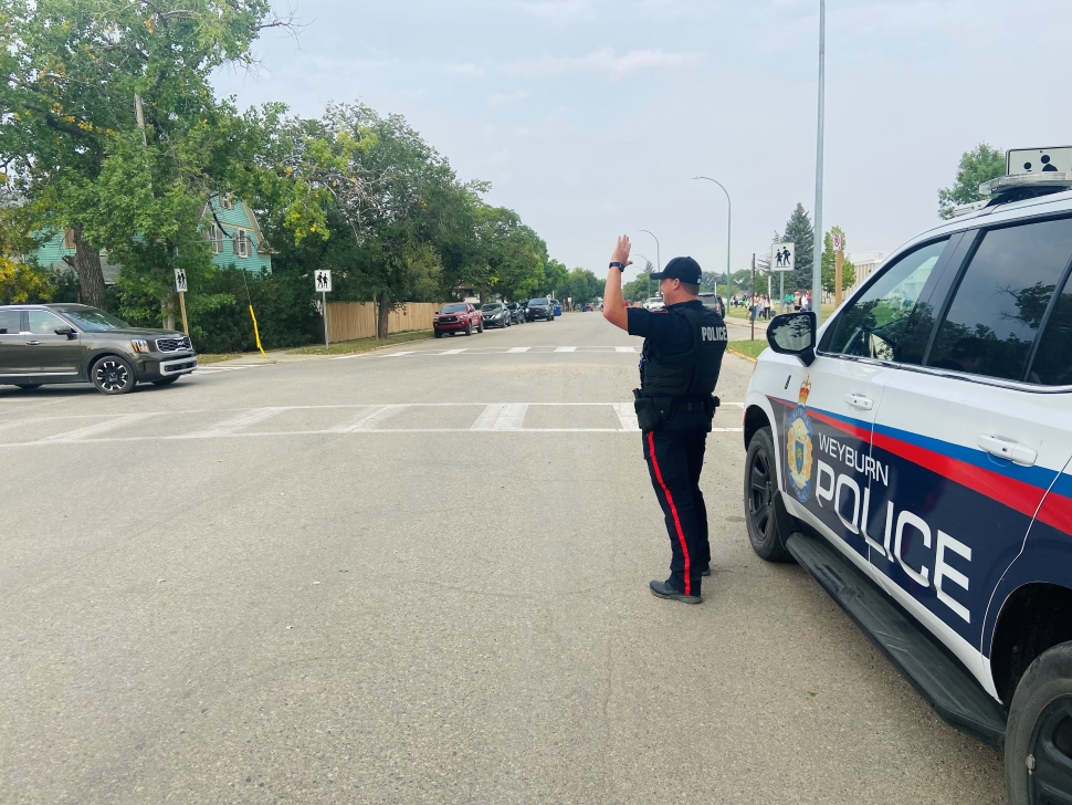 Constable Brandon Brown directing traffic near Weyburn Comprehensive School.