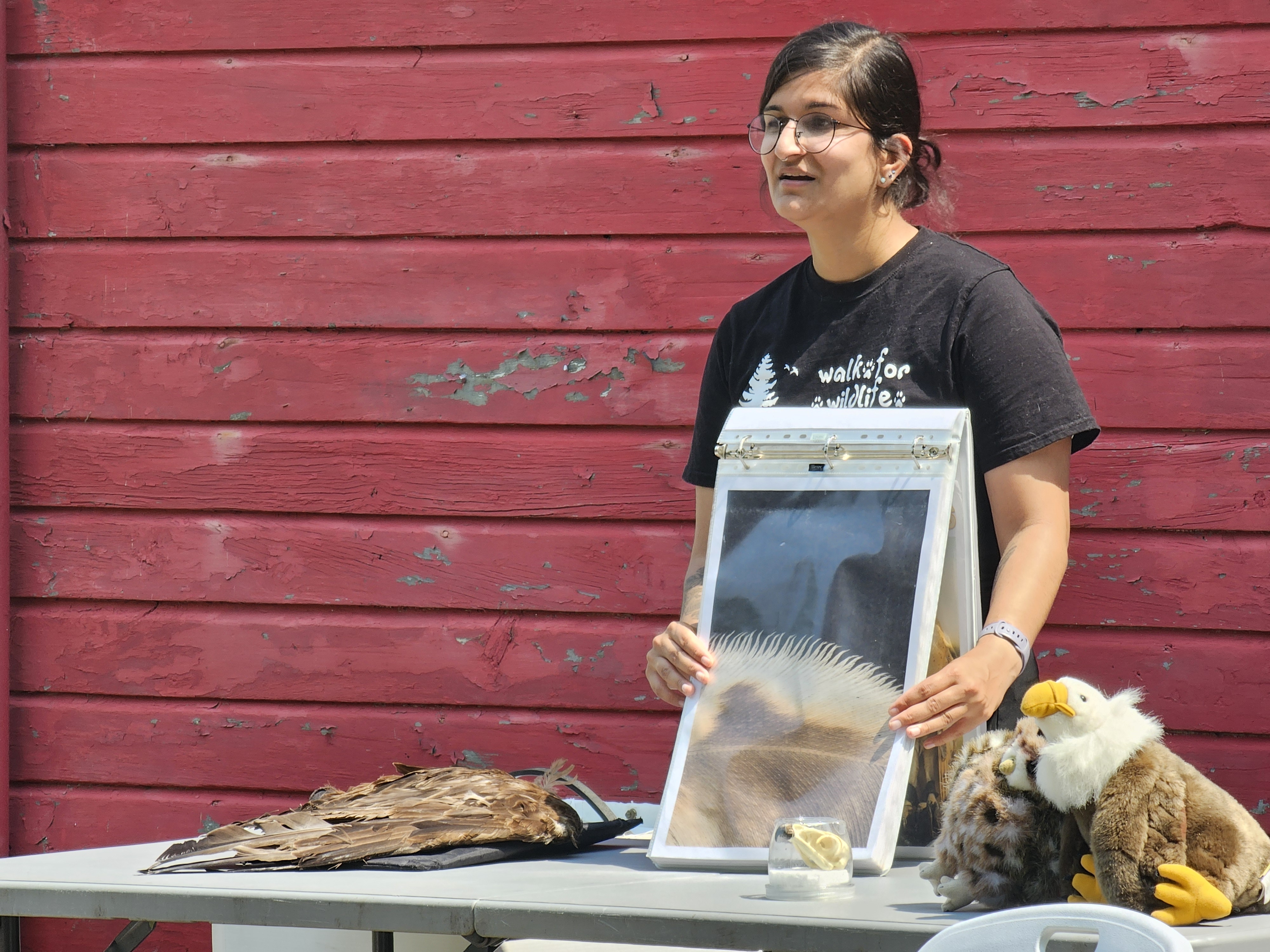 Julia Burcar shows off pictures and educational material during the presentation