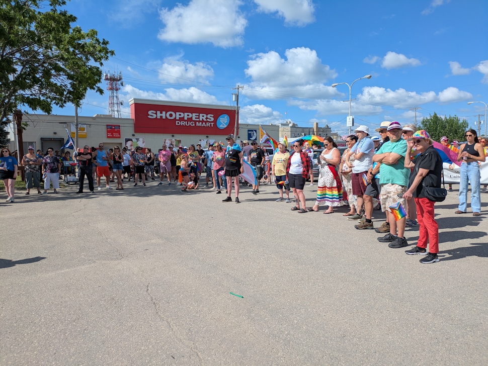 The crowd gathered in front of Prairie Fusion Arts & Entertainment, as speakers took the stage to hear heartfelt speeches before embarking on the walk through town. PortageOnline/Maryssa McFadden
