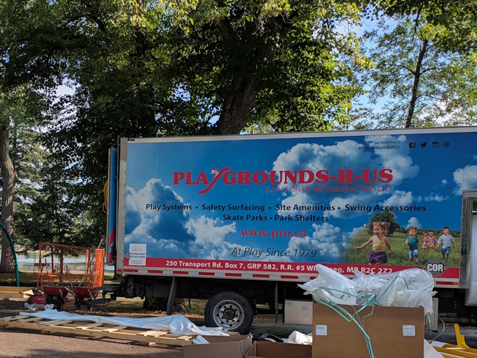 The 'Playgrounds-R-Us' truck on Island Park this morning, as the crew began installing Portage's first wheelchair-accessible swing, a project three years in the making. PortageOnline/Maryssa McFadden