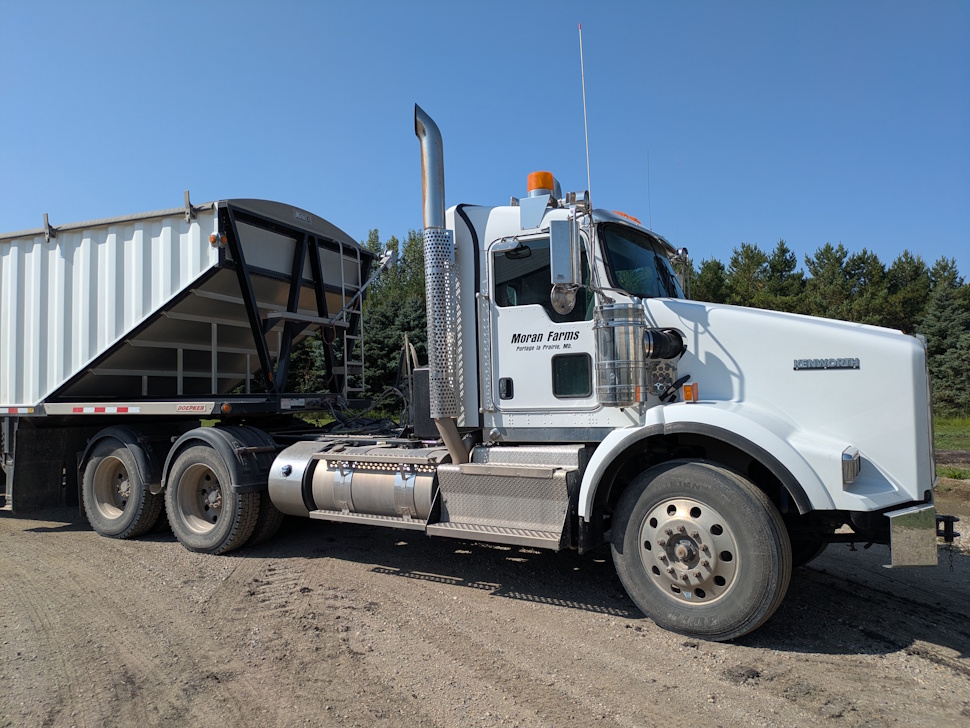 A Moran Farms truck sits ready for the fields, part of the family’s 17,000-acre operation west of Portage la Prairie where they grow corn, soybeans, canola, and wheat. PortageOnline/Maryssa McFadden