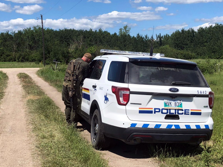 An officer is pictured on the scene of Wildman's property in the R.M. of St. Clements on Tuesday. (RCMP Manitoba)