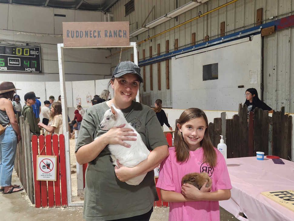 Owner Jacqueline Rudd and her daughter Beau, Holding a baby goat and baby bunny. PortageOnline/ Tristen Sokolosky