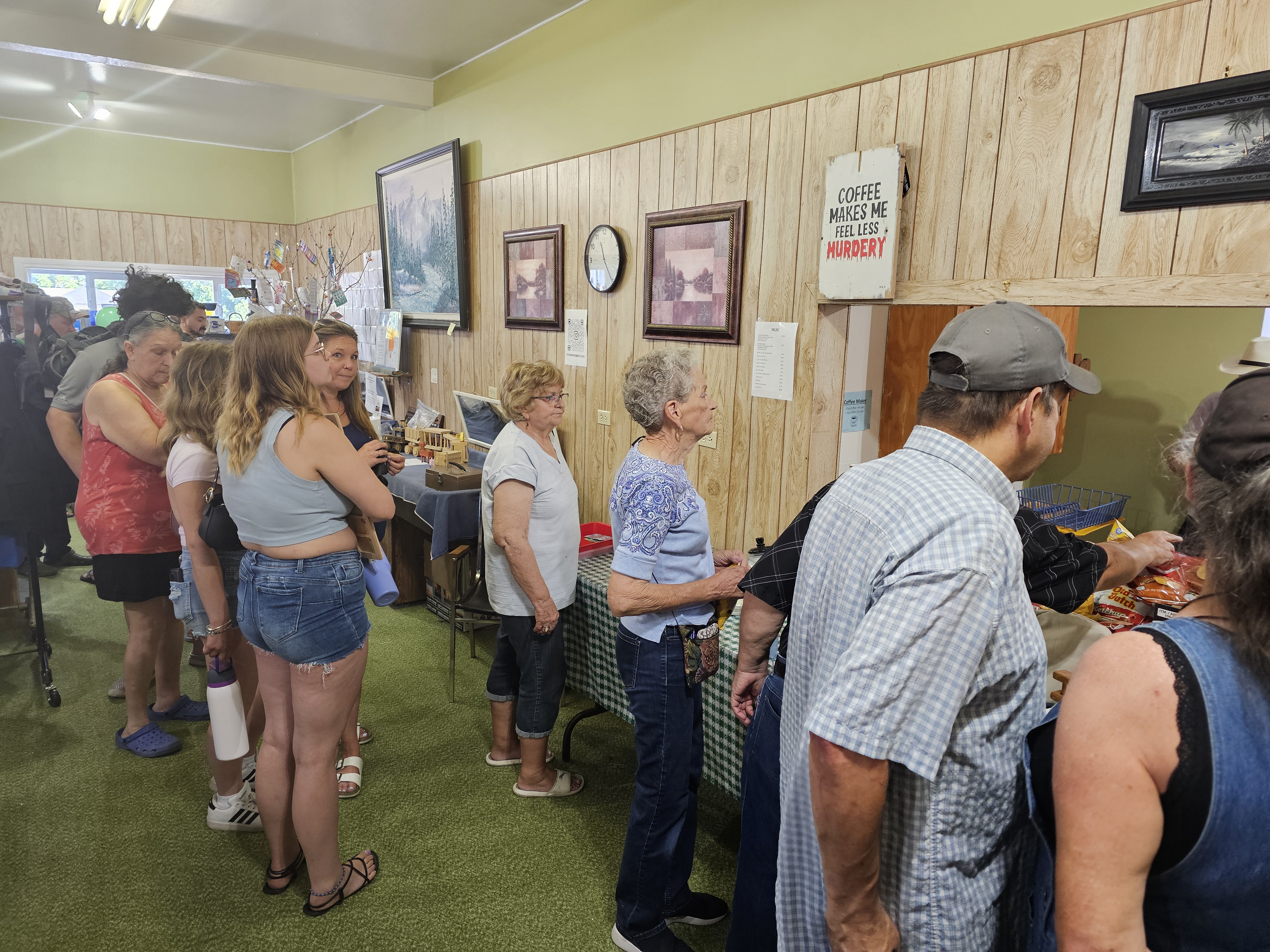 People swarm the line for the community barbeque, raising funds for the Holbens