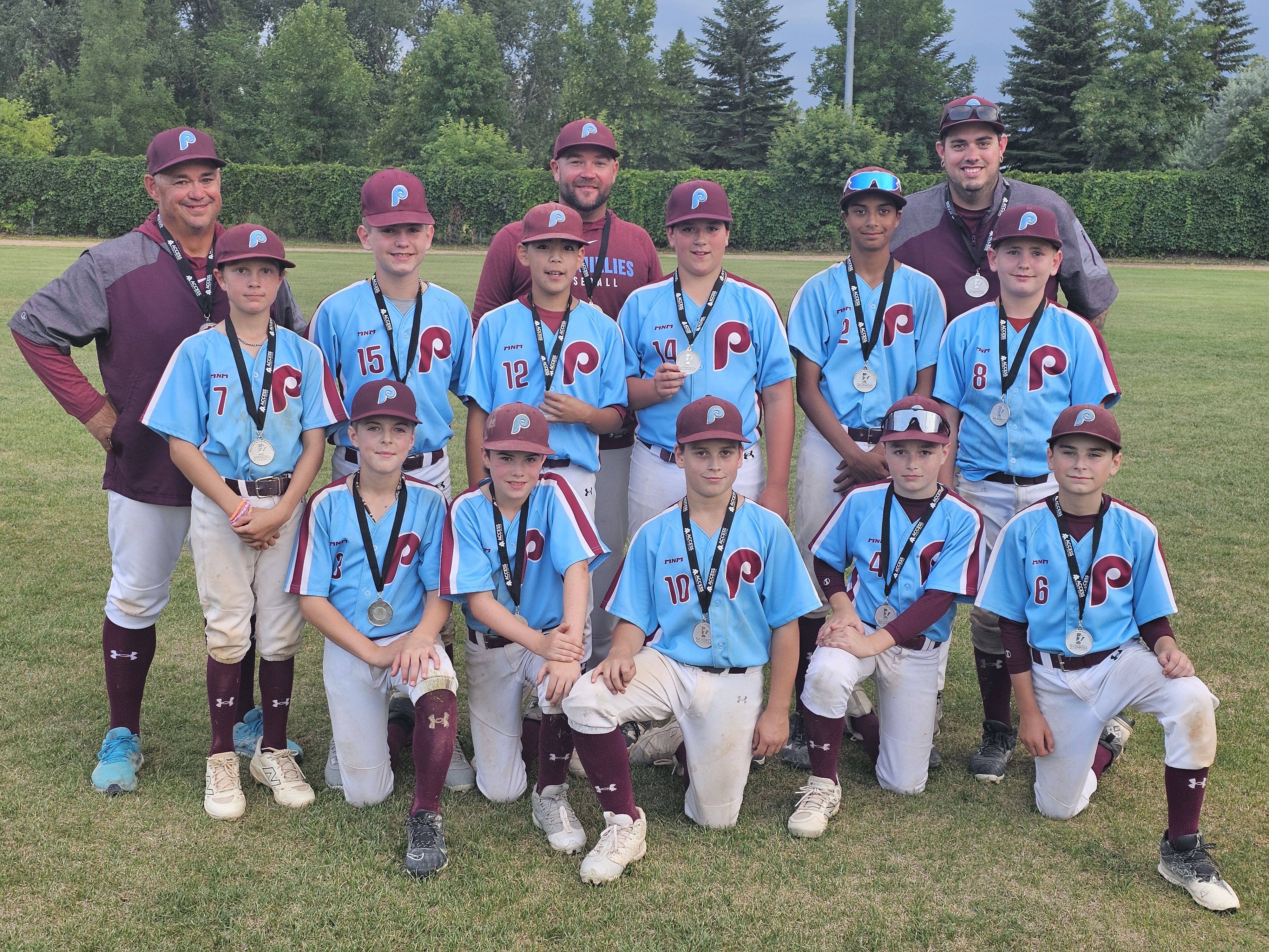 The Portage Phillies hold their second place medals after a tough loss to the Fort Gary Giants
