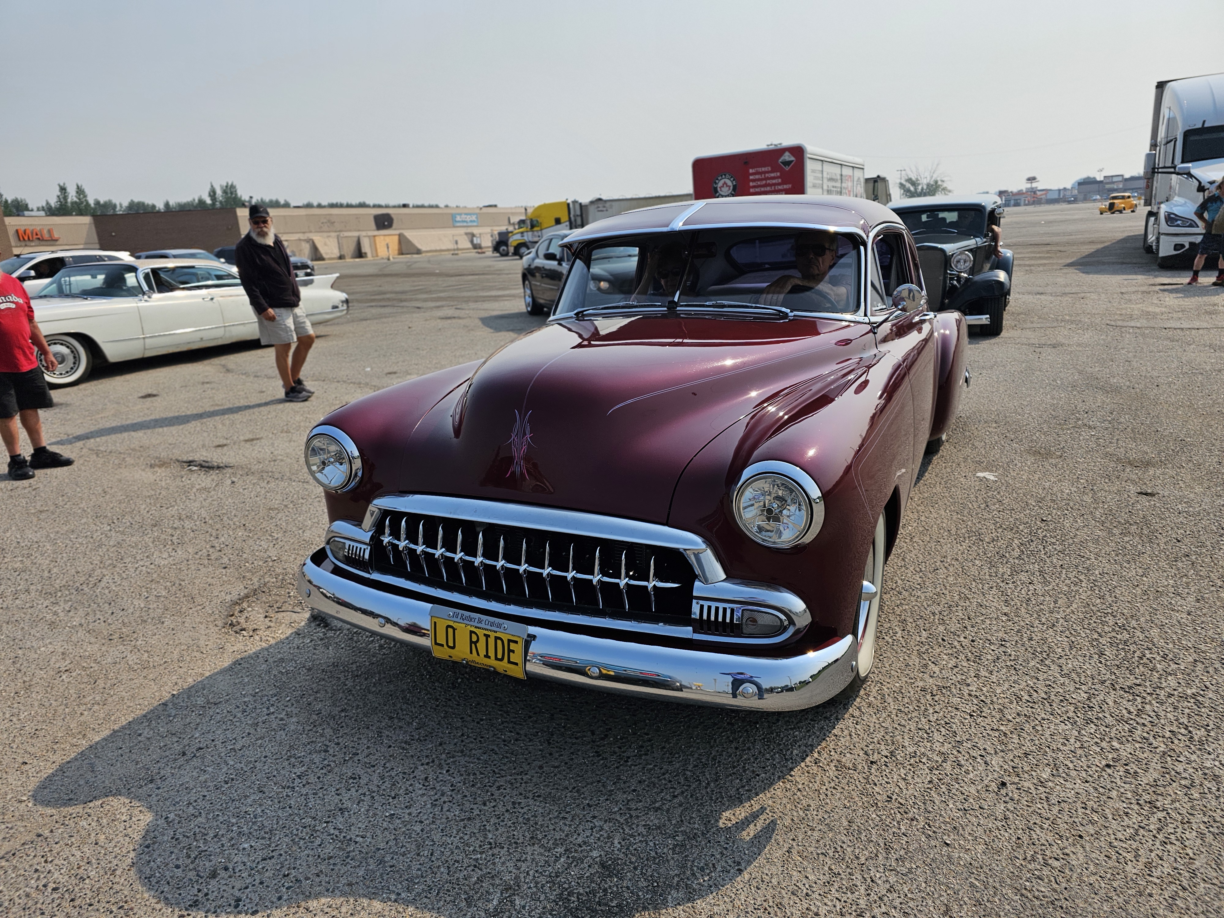 A deep burgundy 1953 Chevrolet, exuding a cool, low-slung vibe.