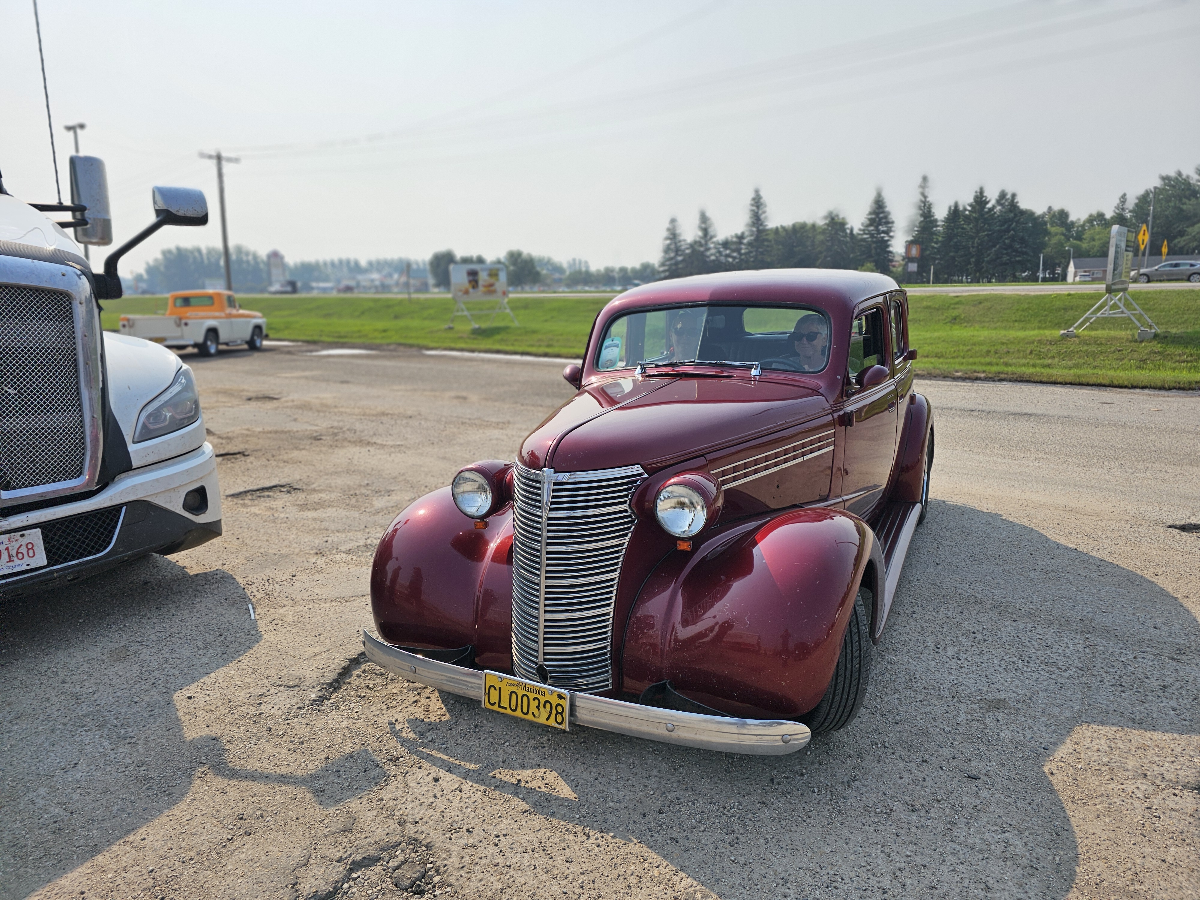 A deep maroon 1937 Chevrolet, another classic example of pre-war automotive style.