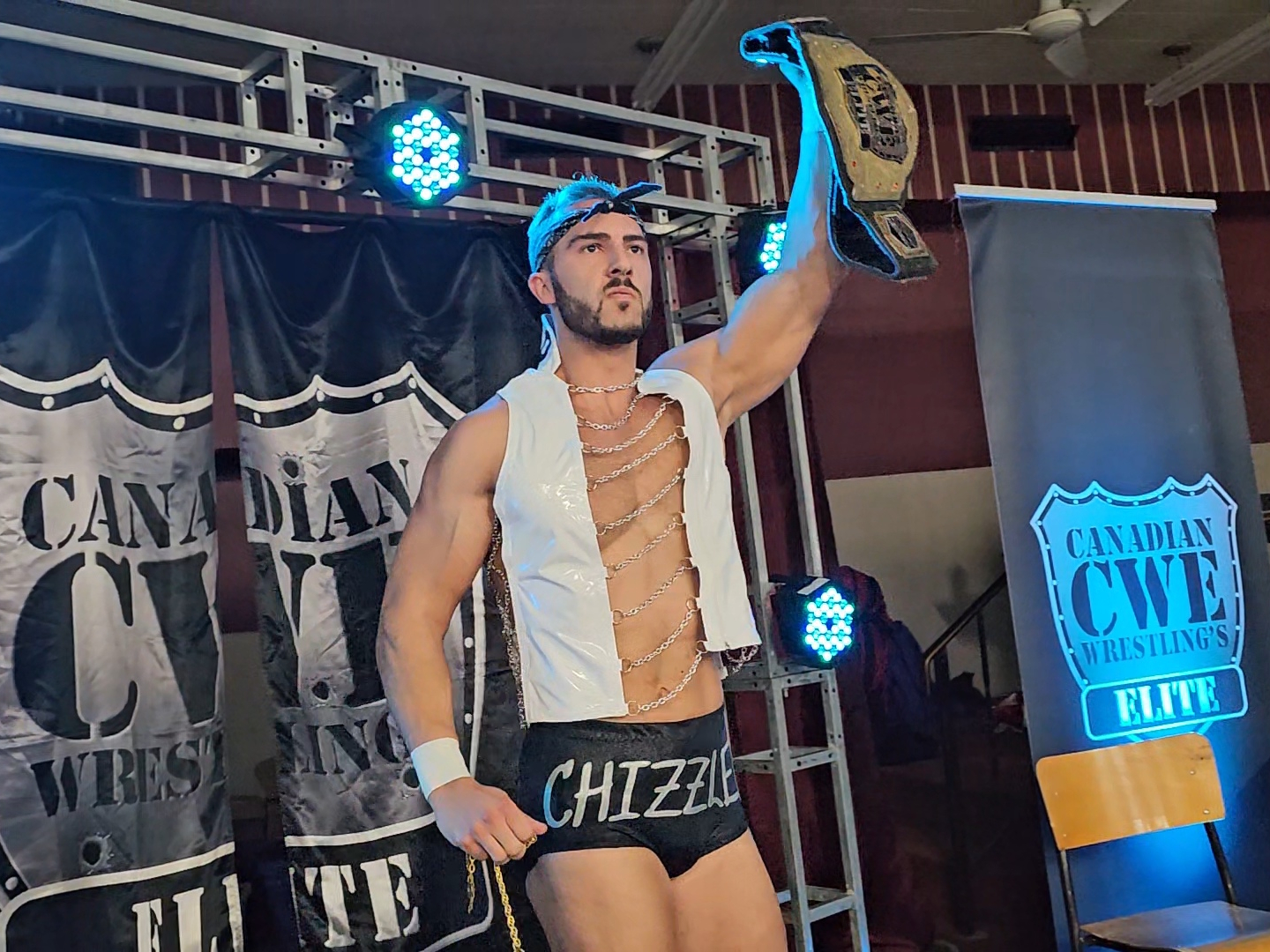 Chizzled Chad Daniels holds up his CWE Championship belt with no shortage of pride