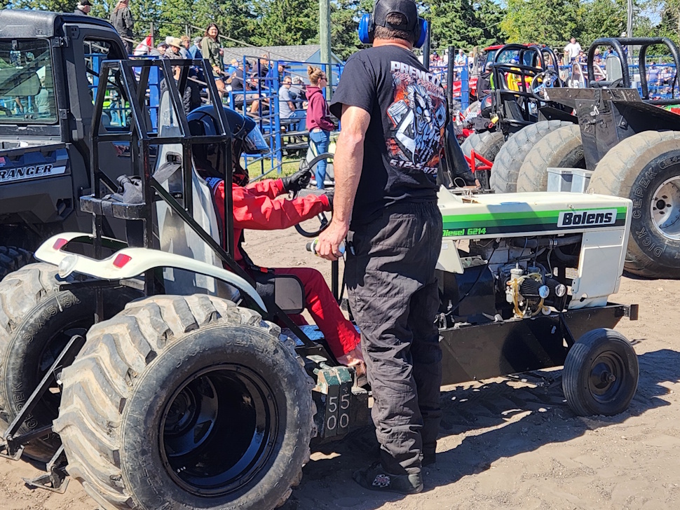 Joise Penner and her Dad preparing the Mini, and pull for the first time.    PortageOnline/ Tristen Sokolosky