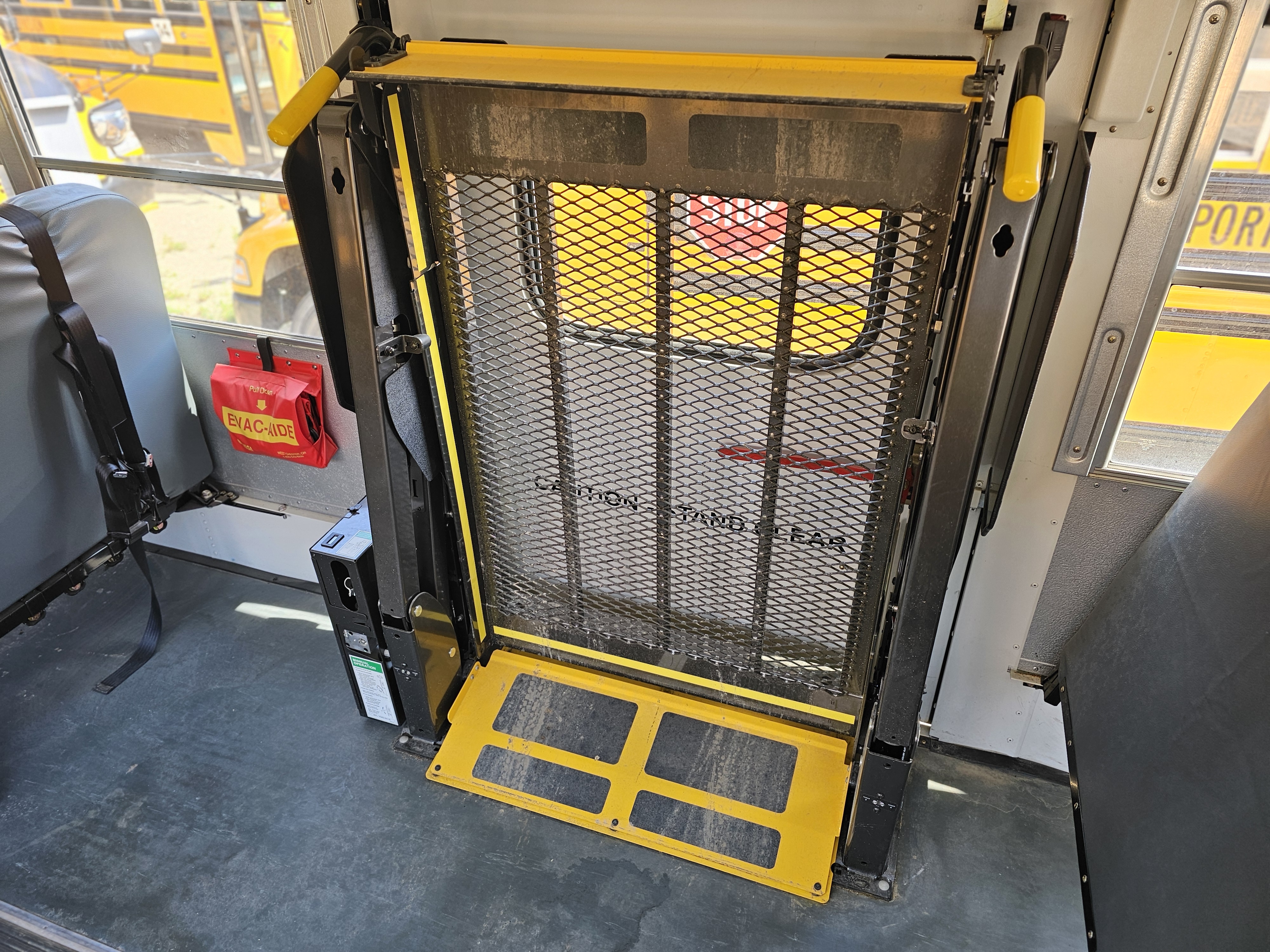 The lift folds up on the inside of the bus