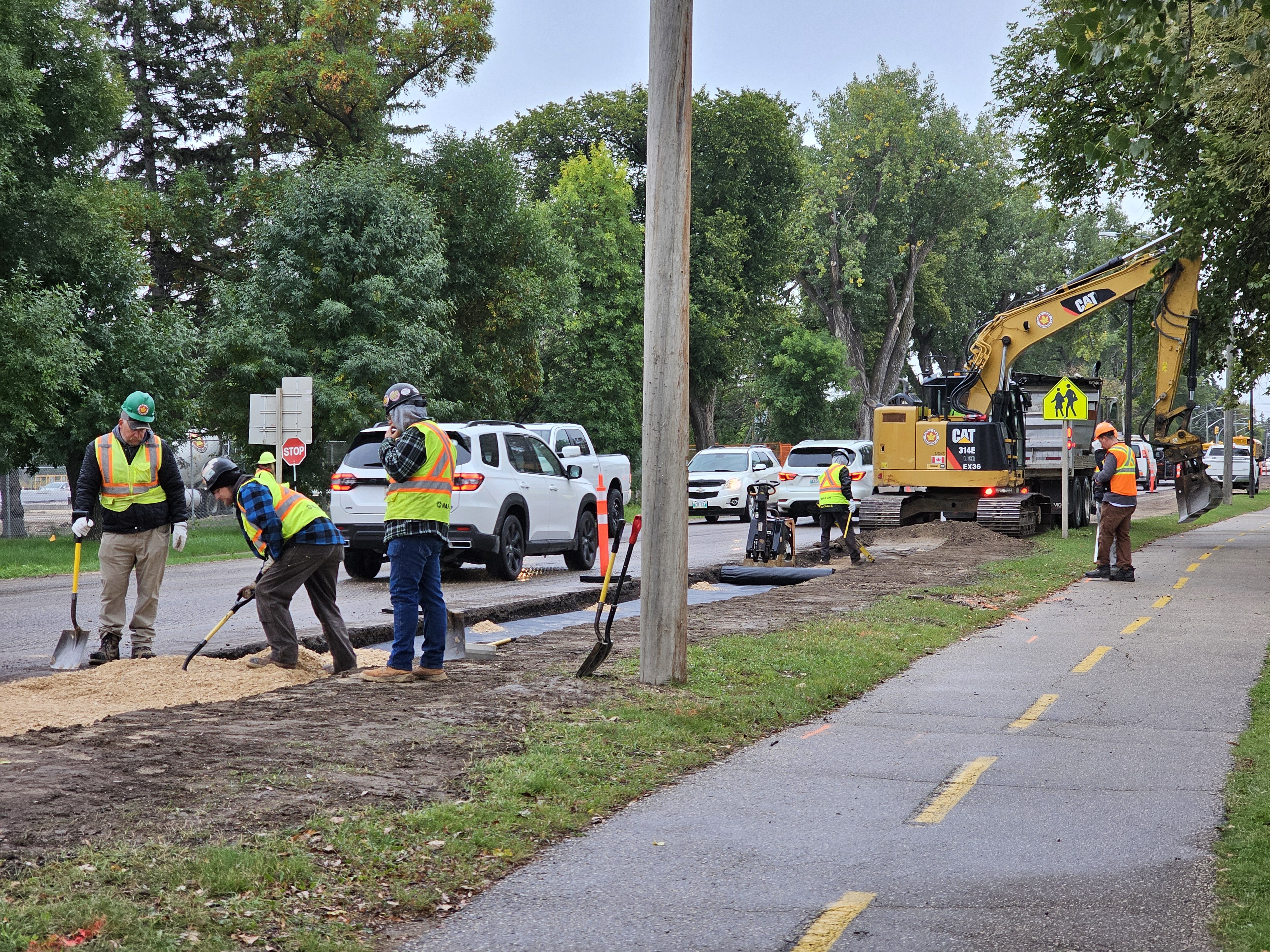 Construction crews hard at work on the PR 240 project, on the rainy morning of the first day back to school.