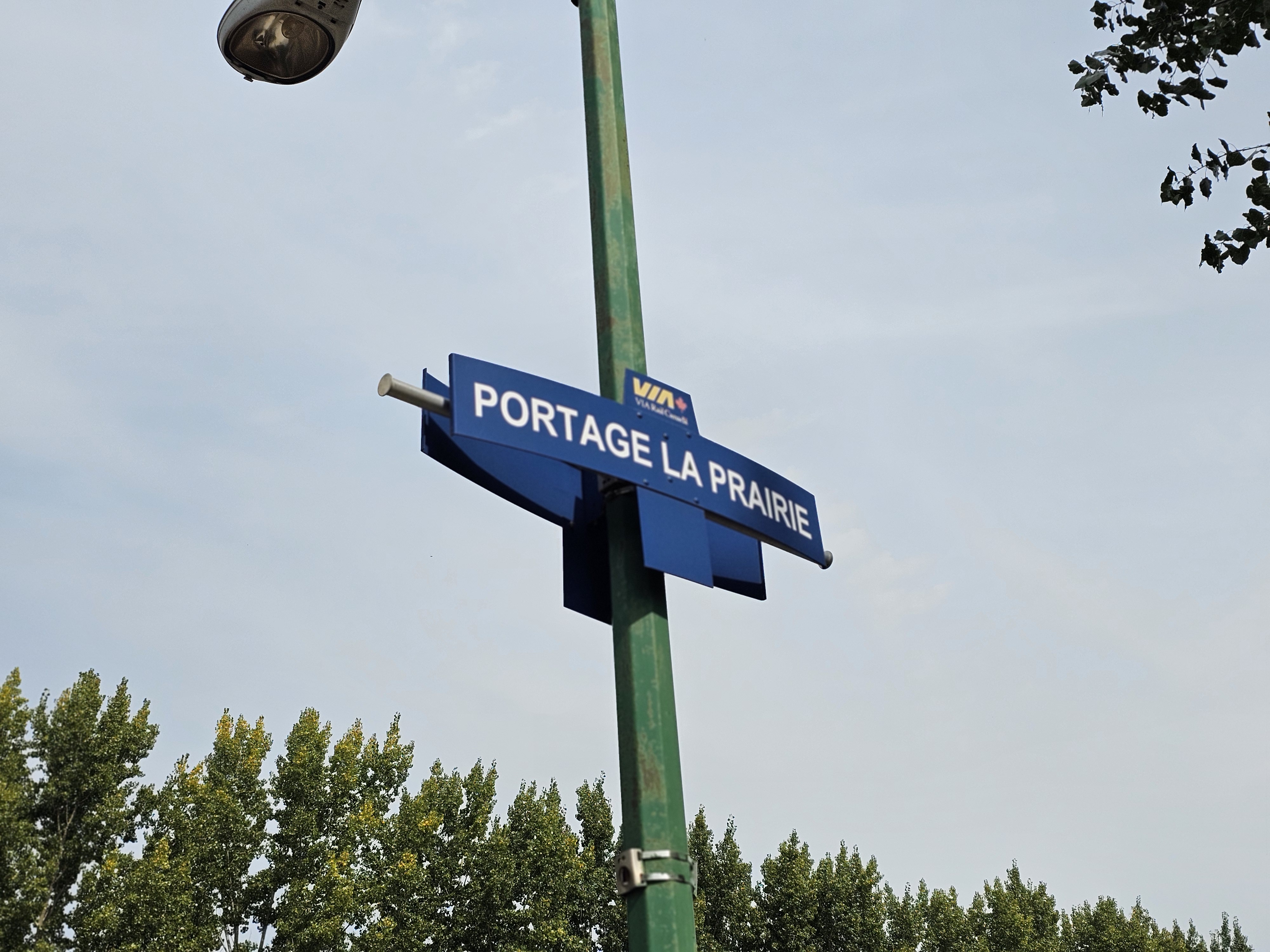 A sign reads "Portage la Prairie" at the city's former passenger train station.