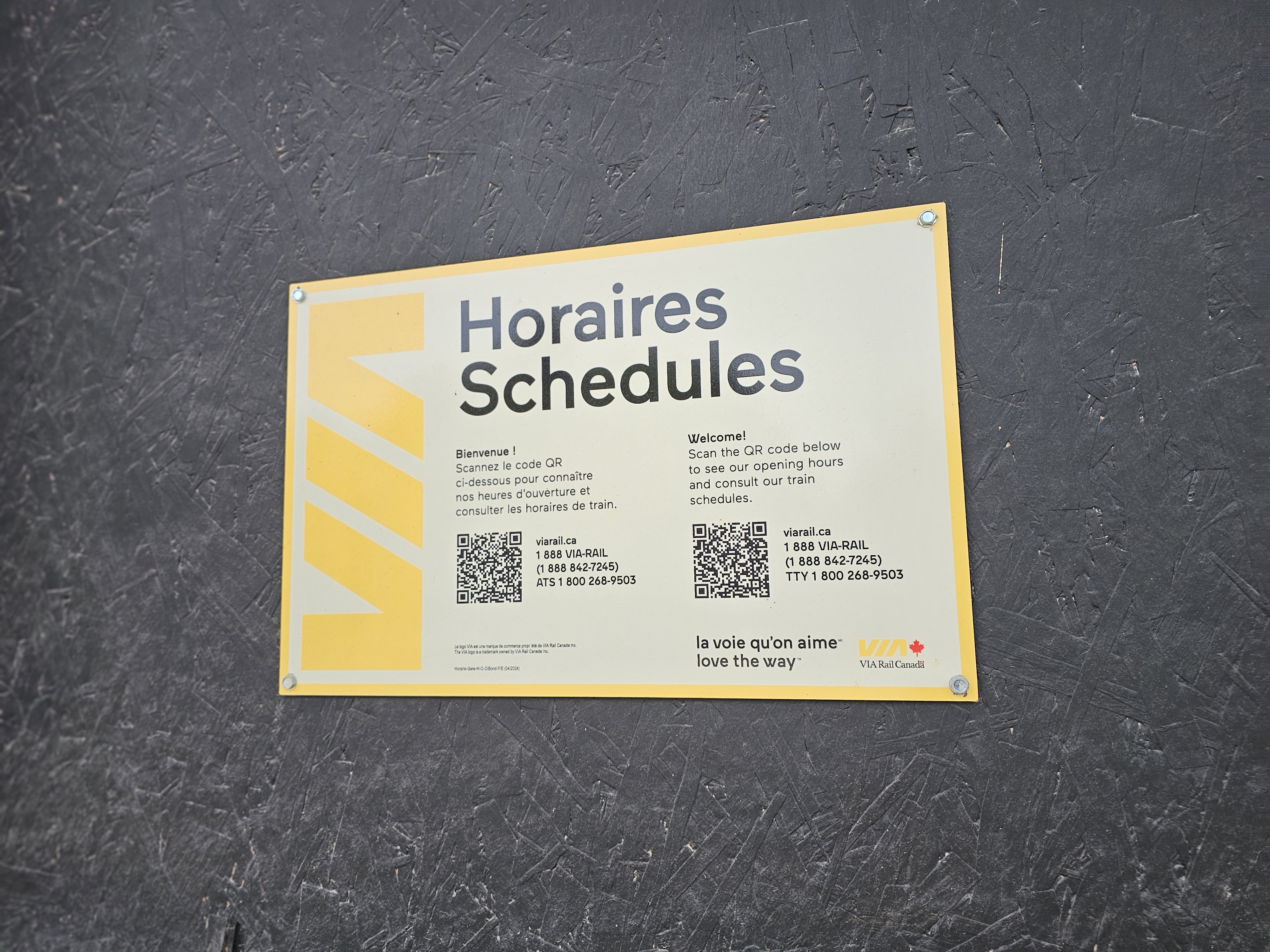 A single sign from Via Rail indicates to anyone who passes by how they can ride a passenger train.