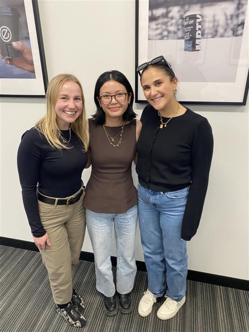 Ayesha BAdiola in the middle with two people from her work placement on either side of her