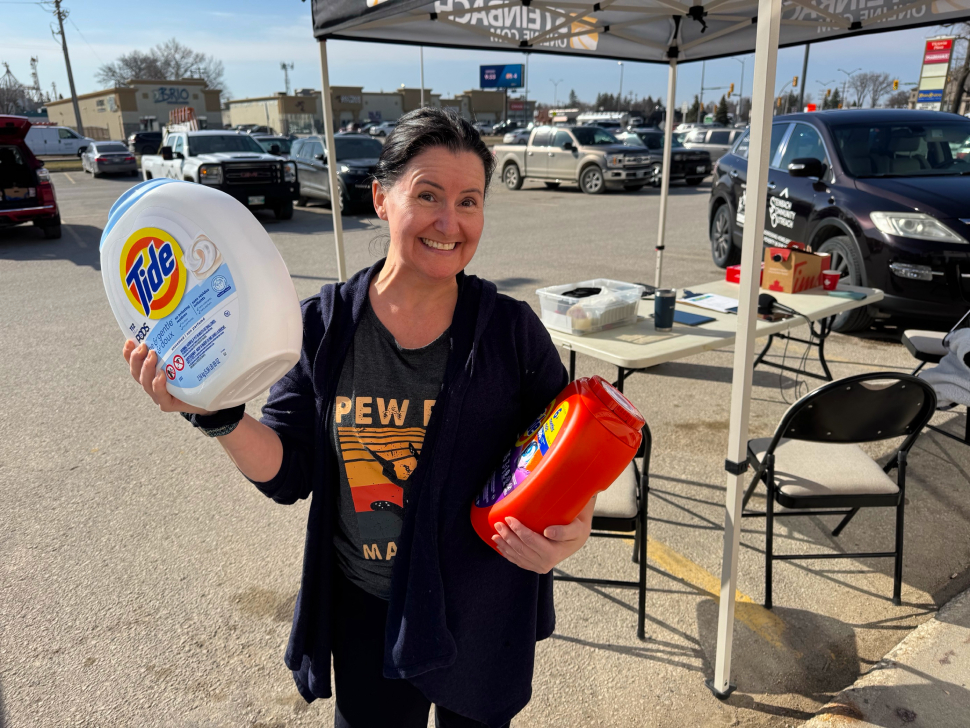 a soap-er hero bringing soap for hope donations to pharmasave in steinbach