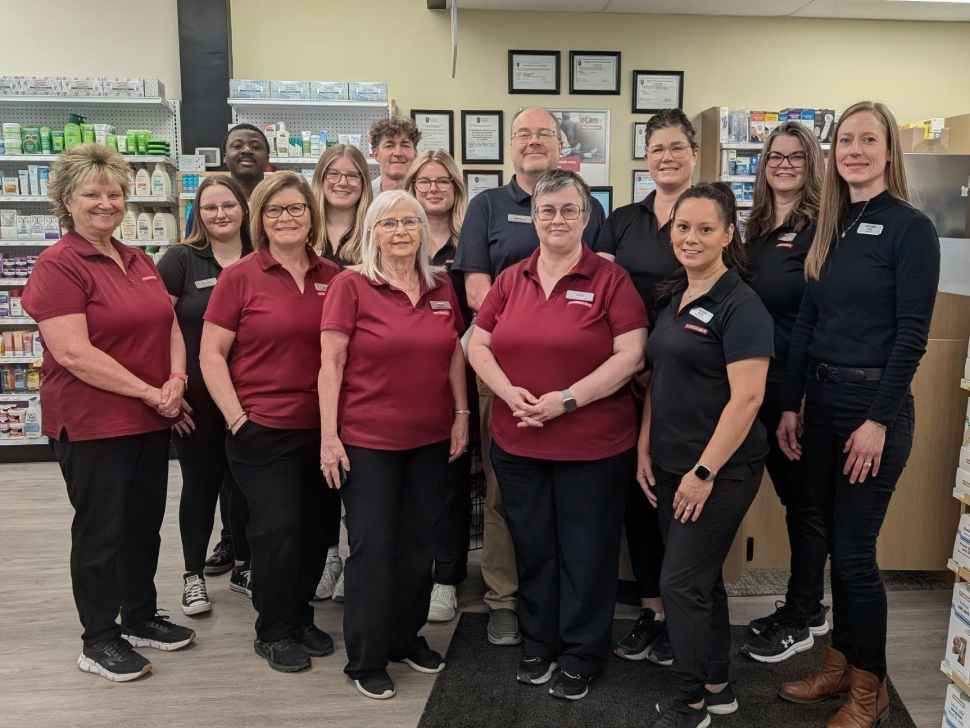 a group of people in pharmasave uniforms