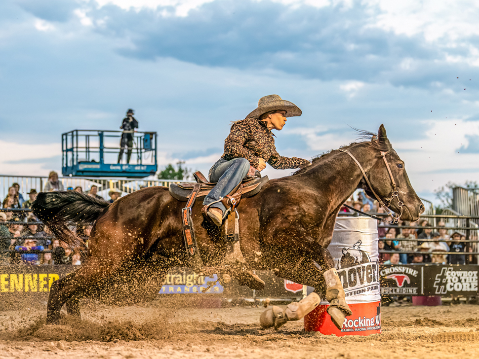 a man on a bucking bronco - Hanover Ag Sponsored