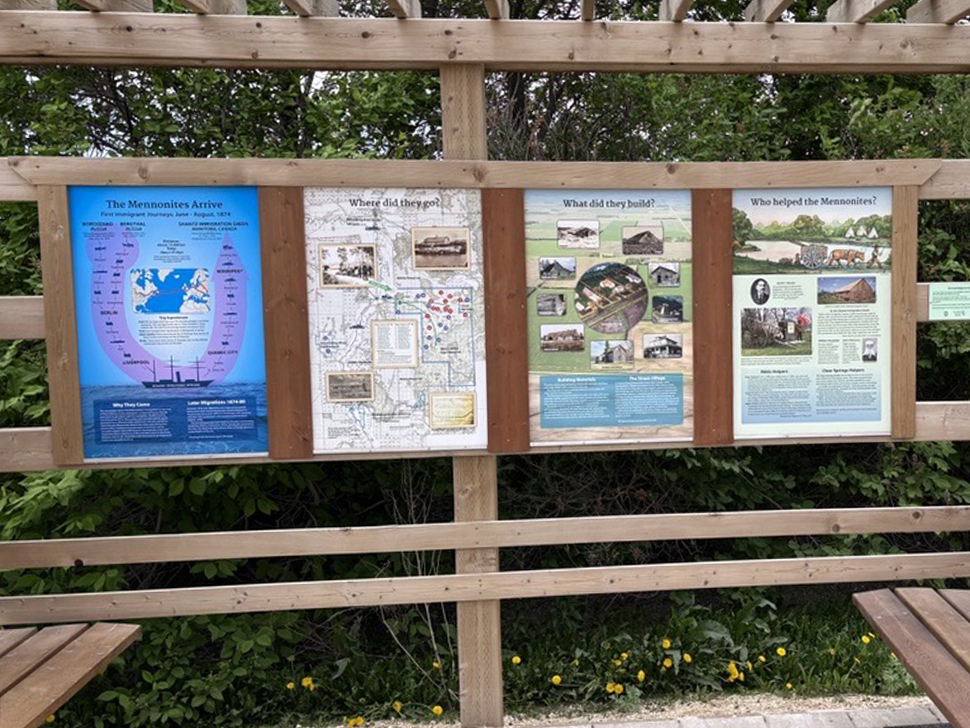 Kiosk panels telling the Mennonite story of early life in Manitoba.