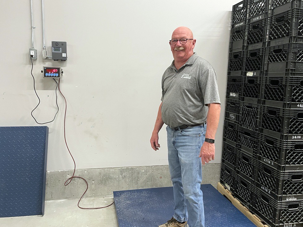 Ken Dyck standing on the scale.