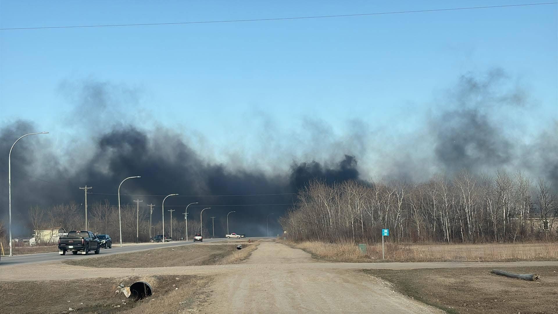 Thick, dark smoke rises from an active fire near Sandy Bay Ojibway First Nation, Manitoba, April 2025. The blaze contributed to widespread smoke impacting the region over the weekend amid dry spring conditions.