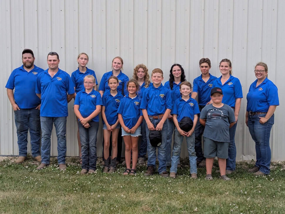 Portage 4-H beef club members stand with 2025 beef buyers at the Portage Ex.