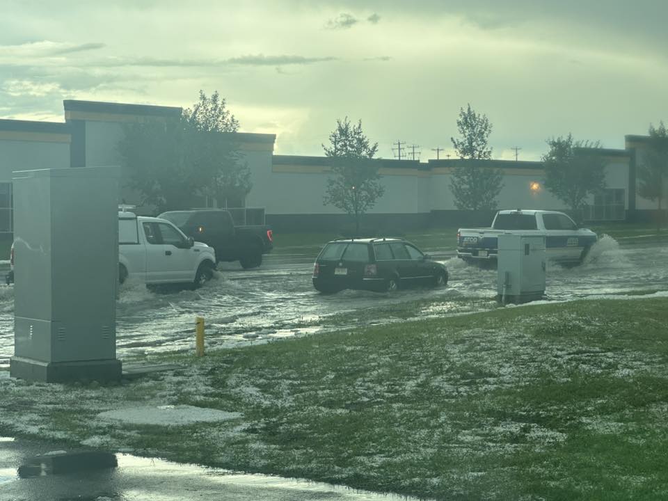 Vehicles drove through flooded streets in Airdrie after Thursday’s storm brought heavy rain and hail. 5/5 Ask ChatGPT