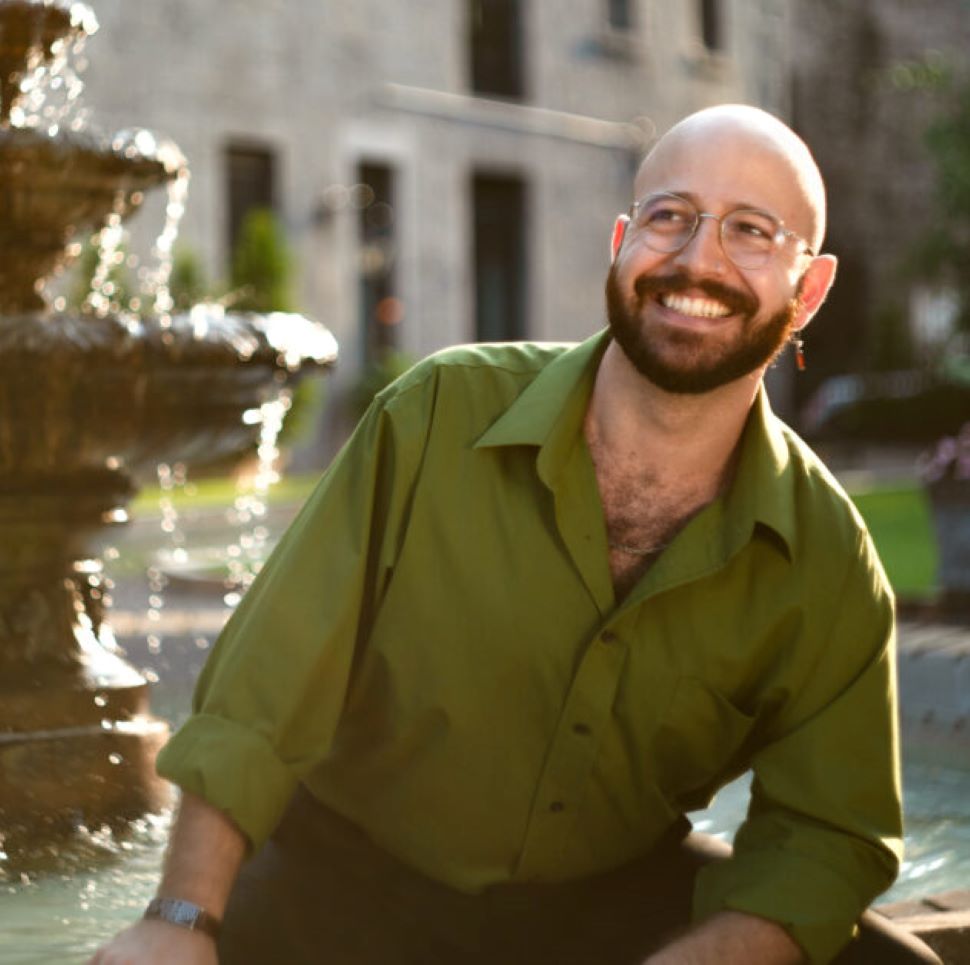Haitham Haidar posing beside a fountain.