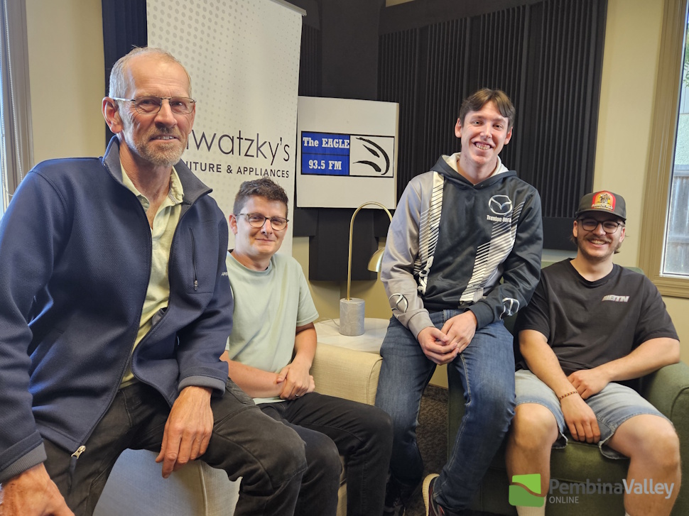 people sit on chairs in a studio 