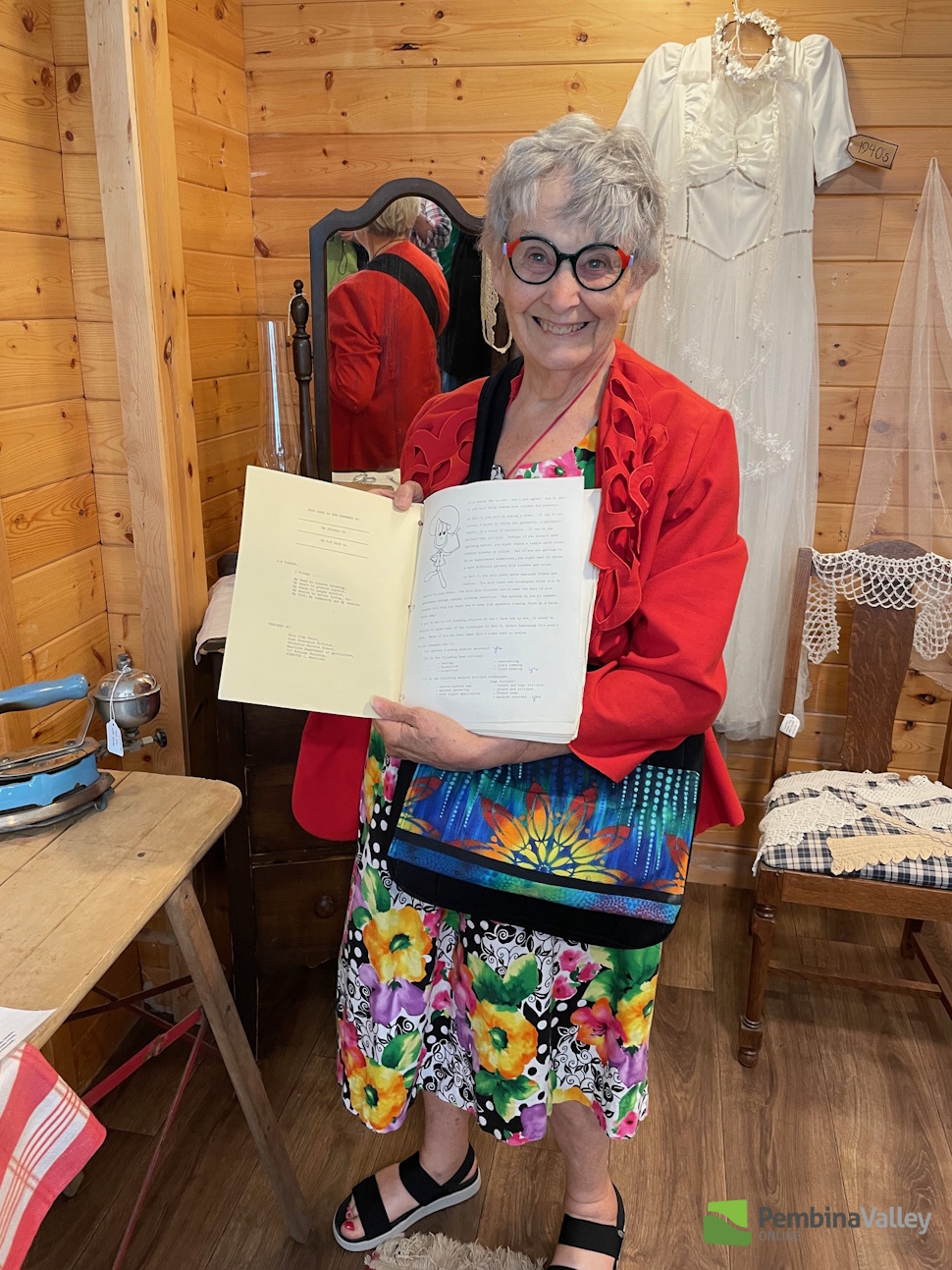 a woman holds an open book