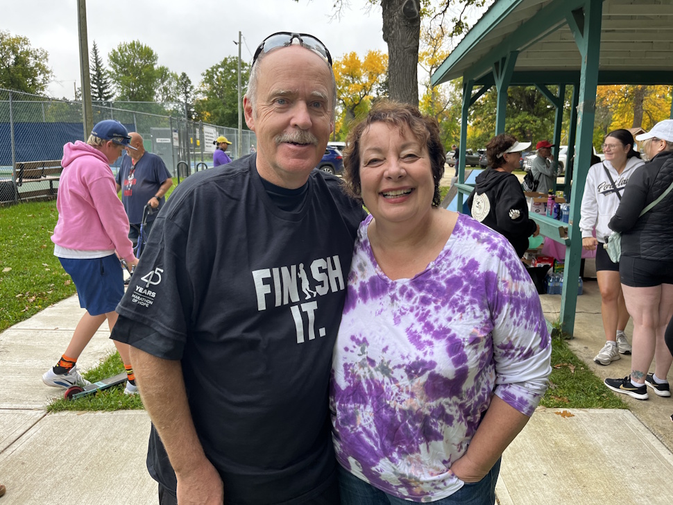 Brian Mooney and his wife, Karie, take part in the Terry Fox Run at Island Park on Sunday, joining more than 80 participants who raised nearly $3,000 for cancer research. PortageOnline/Cory Knutt