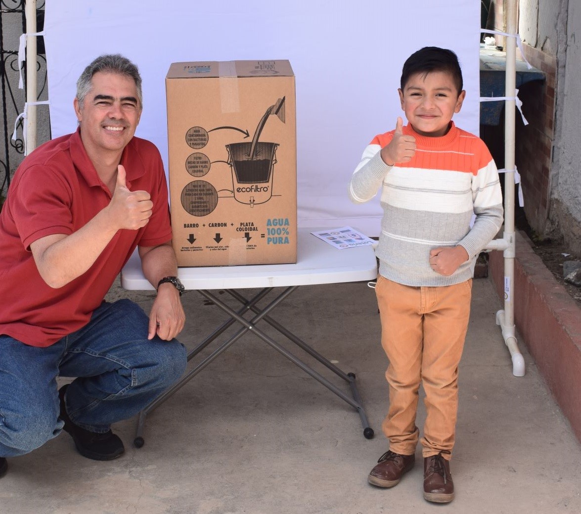 Jose Prem with a boy from Guatemala. All the sponsor children there recently received a new water filter. 