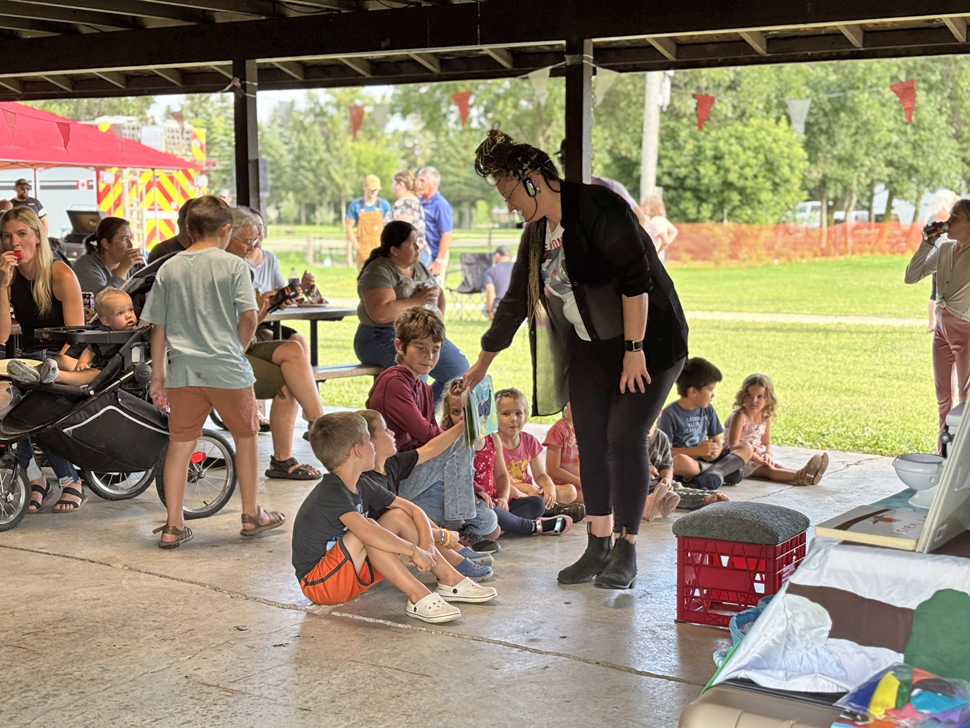 Many families with young children attending the community BBQ in the St Pierre Carillon Parc, celebrating the official opening of the library.