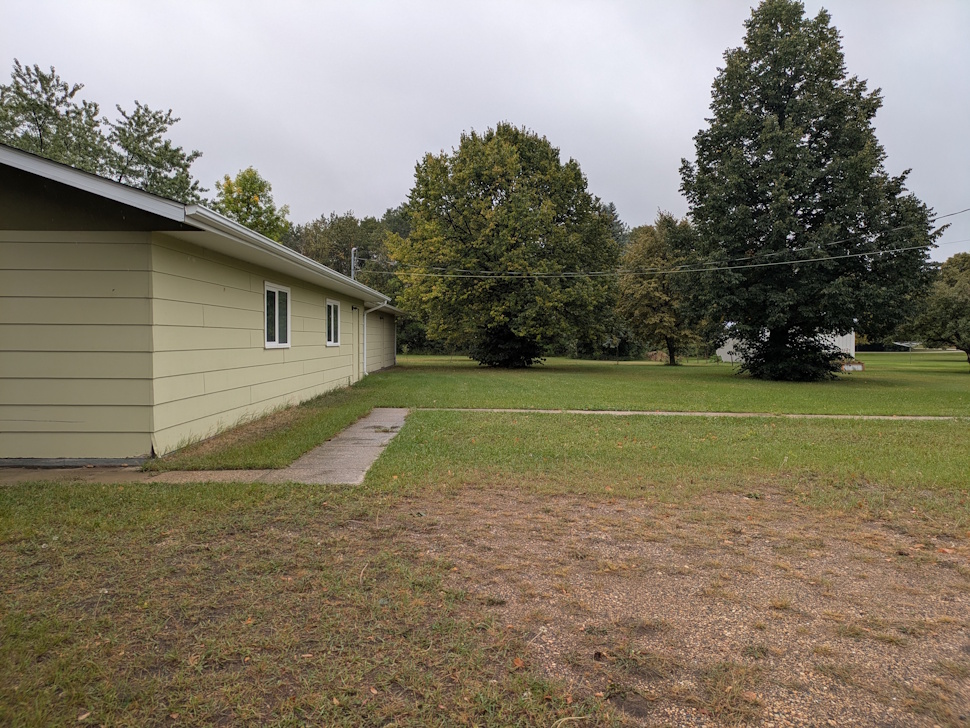 This side area of the future childcare centre will soon be transformed into a fully fenced outdoor play space, giving children a safe and fun place to explore, play, and grow. PortageOnline/Maryssa McFadden