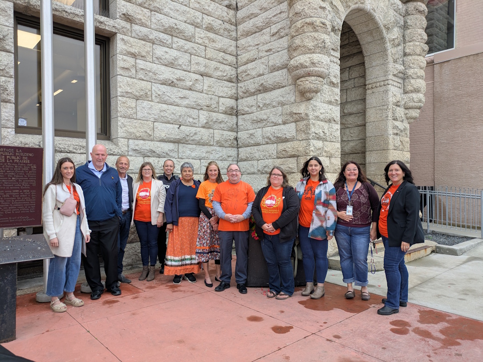 City officials, residential school survivors, and community members gather at City Hall on September 19 for the Truth and Reconciliation flag-raising ceremony in Portage la Prairie. PortageOnline/Maryssa McFadden