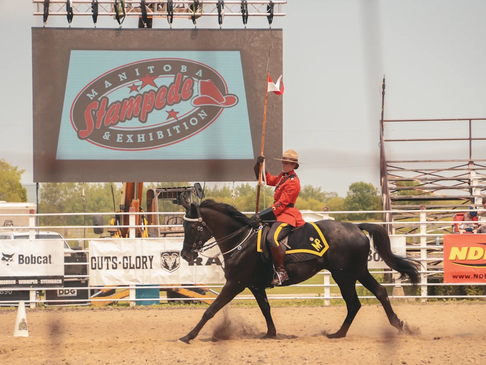 An RCMP officer on horseback patrols the grounds at the Manitoba Stampede in Morris in this file photo.