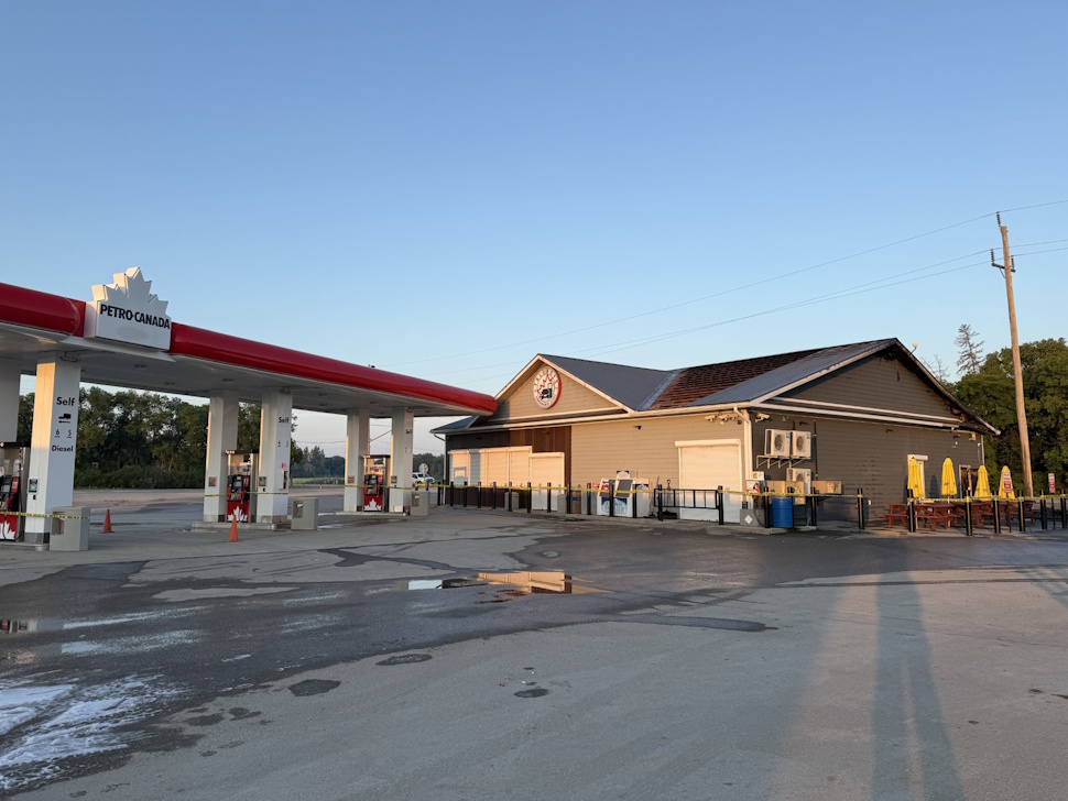 Exterior view of Tallboys with Petro-Canada fuel pumps in front, taken during the rebuilding process after a July fire.