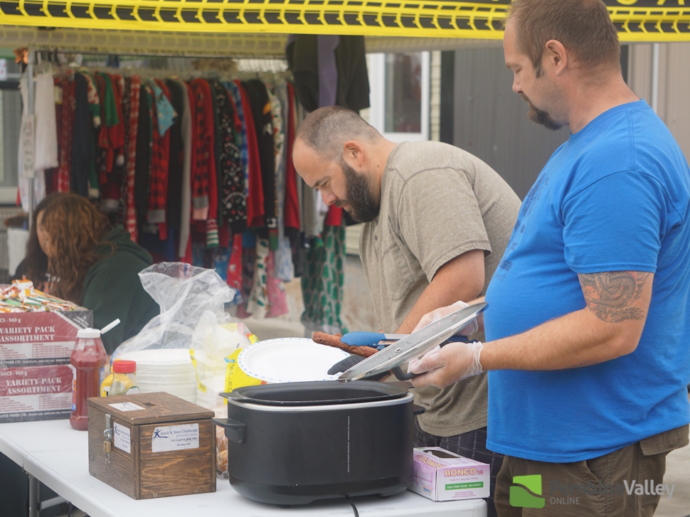 people enjoy a barbecue