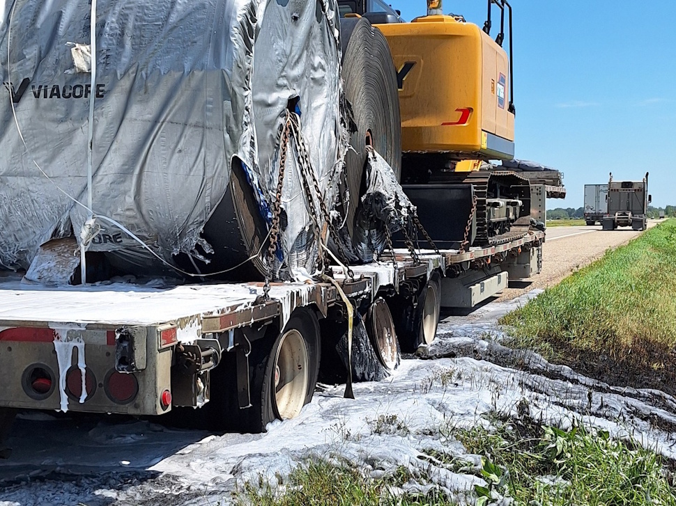 Semi trailer engulfed in flames on the side of Highway 1 near Austin.
