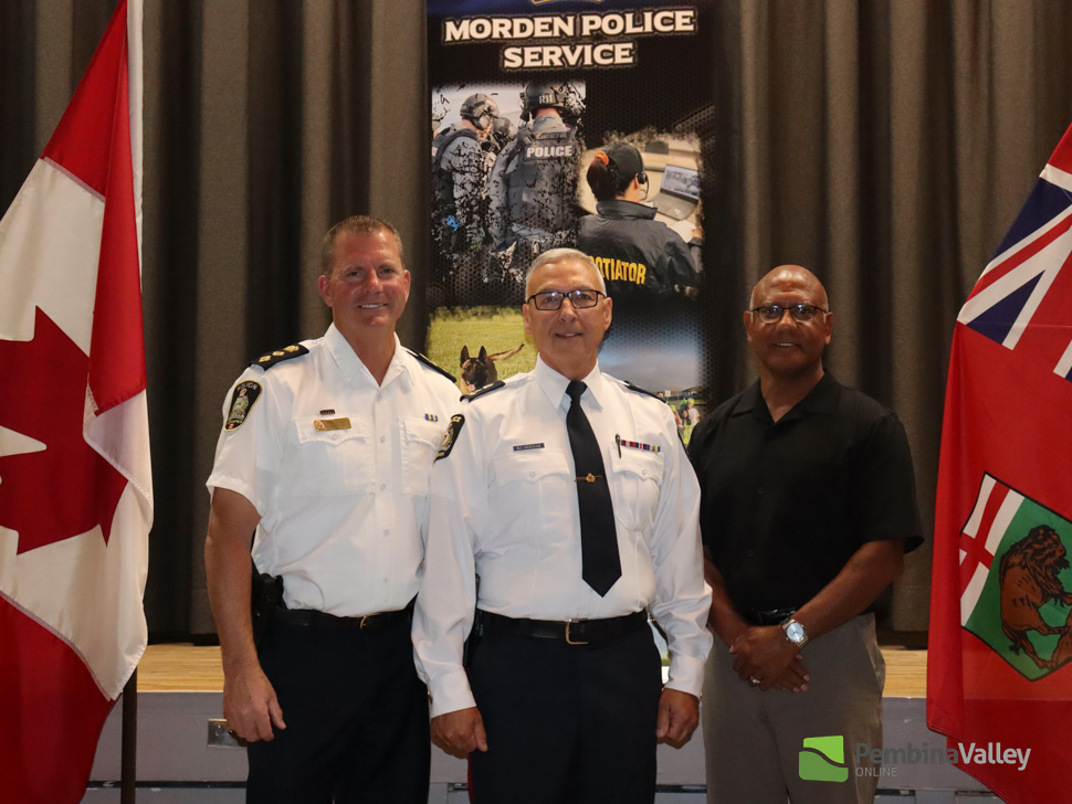 Jim Mirza, the executive director of the Manitoba Association of Chiefs of Police with Chief Neduzak