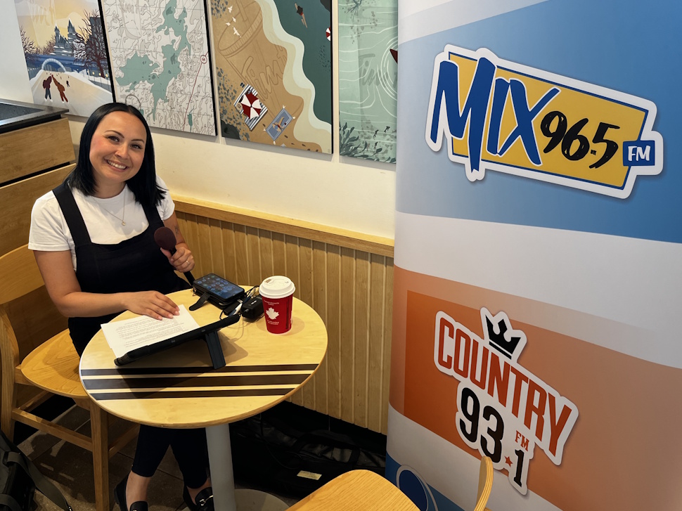 Country 93 morning show host Brittany Boschman broadcasts live from inside the West End Tim Hortons during Camp Day.