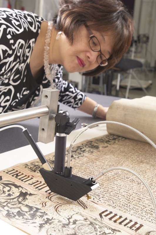 Season Tse, Senior Conservation Scientist at the Canadian Conservation Institute, performs microfade testing of the Royal Charter of Hudson's Bay Company in 2012. THE CANADIAN PRESS/Handout - Government of Canada, Canadian Conservation Institute (Mandatory Credit)